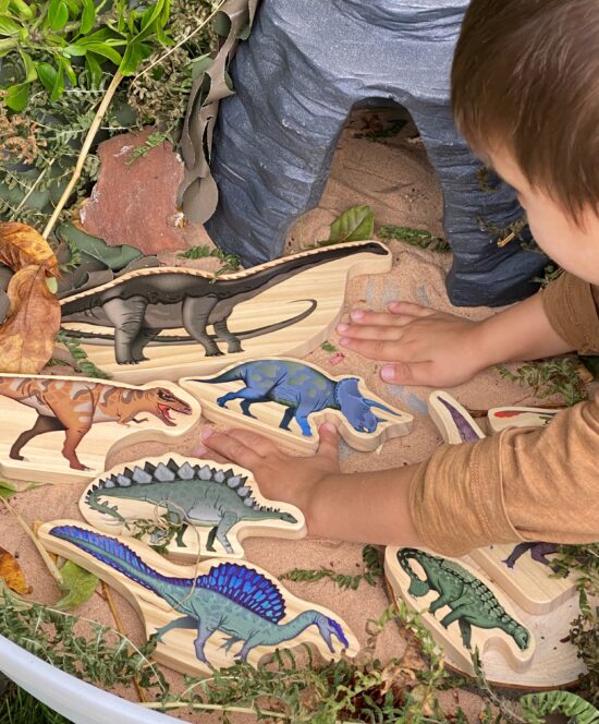 Set of eight dinosaur wooden characters